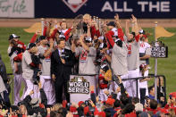 ST LOUIS, MO - OCTOBER 28: Lance Berkman #12 of the St. Louis Cardinals holds up the World Series trophy after defeating the Texas Rangers 6-2 in Game Seven of the MLB World Series at Busch Stadium on October 28, 2011 in St Louis, Missouri. (Photo by Doug Pensinger/Getty Images)