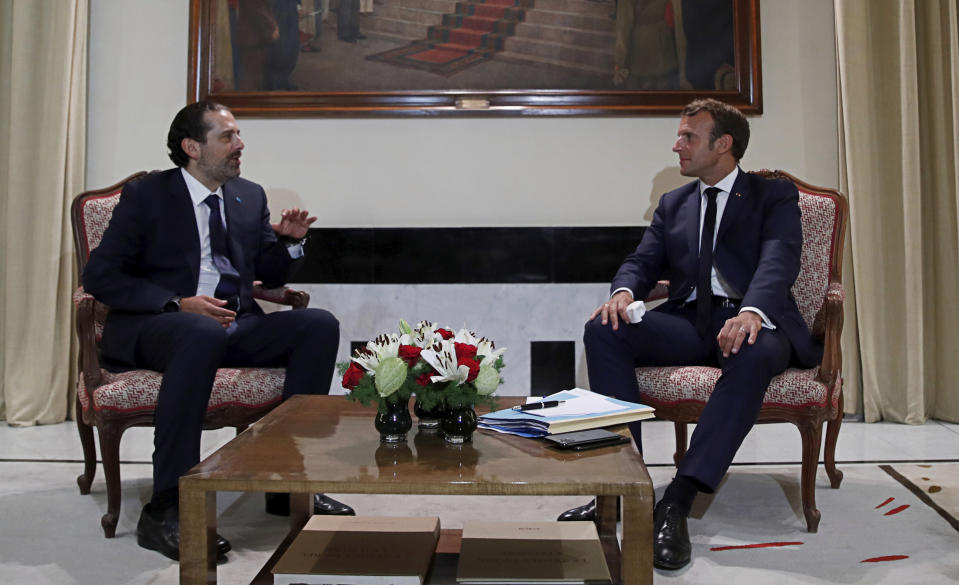 FILE - In this Aug. 31, 2020 file photo, French President Emmanuel Macron, right, meets former Lebanese Prime Minister Saad Hariri, in Beirut, Lebanon. During his visit last week, Macron gave Lebanon’s politicians a road map for policy changes and reform, set deadlines for them to take action and told them he’d be back in December to check on progress. It was a hands-on approach that angered some in Lebanon and was welcomed by others. (Gonzalo Fuentes/Pool Photo via AP, File)