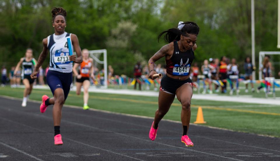 Auburn's Essence Horton-Graves finishes the 4x100 relay in first place during a NIC-10 track and field meet on Thursday, May 2, 2024, at Guilford High School.