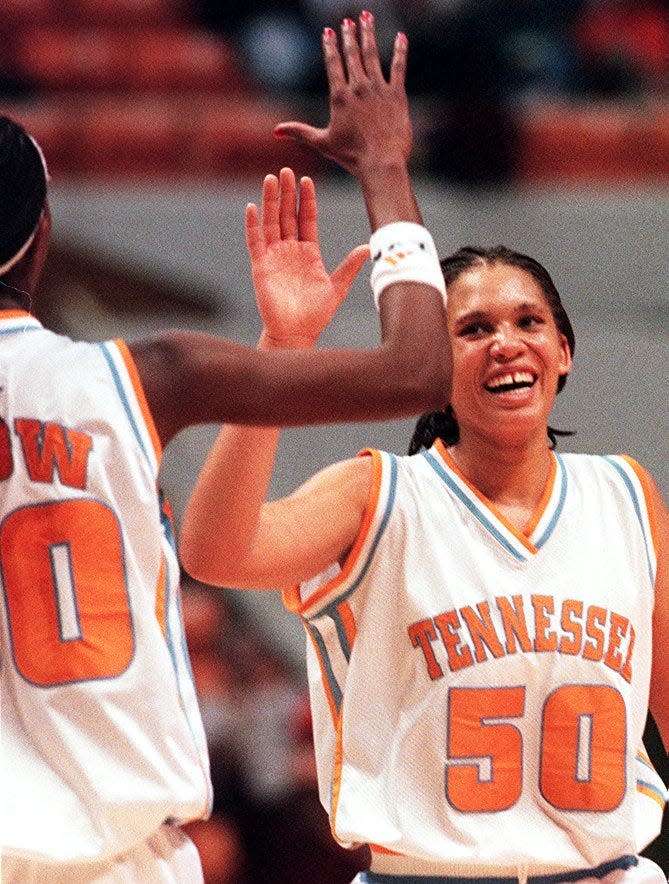 Shalon Pillow gets a high five from teammate Michelle Snow during game with Mississippi State at the Thompson Boling Arena in Knoxville, Tennessee.