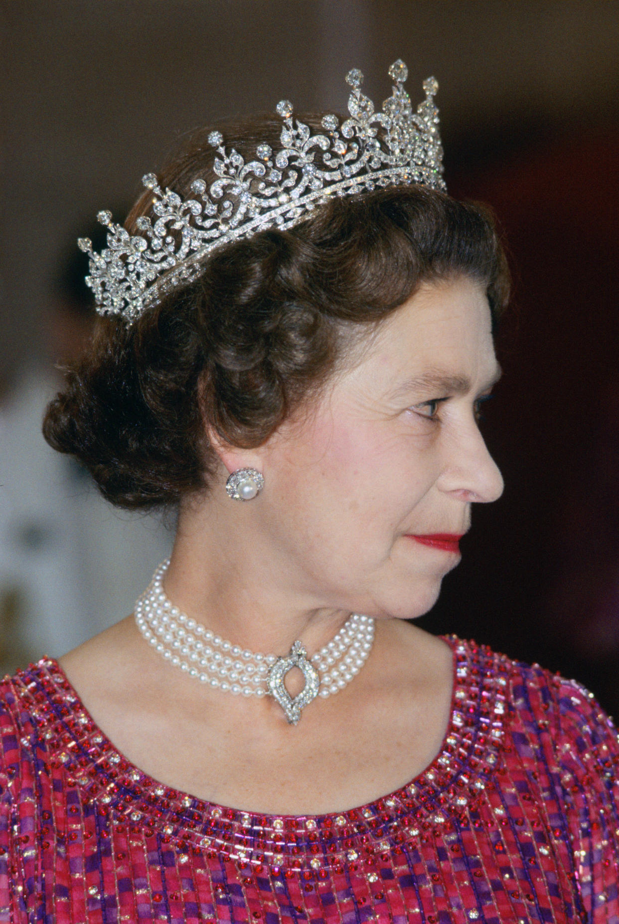 Queen Elizabeth II wears a four strand diamond and pearl choker with 'Granny's Tiara' to an engagement in Bangladesh