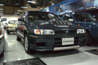 <p>The <a href="https://www.roadandtrack.com/motorsports/a30688393/nissan-pulsar-gti-r-baby-godzilla-sound/" rel="nofollow noopener" target="_blank" data-ylk="slk:Pulsar GTI-R;elm:context_link;itc:0;sec:content-canvas" class="link ">Pulsar GTI-R</a>, Nissan's often-forgotten WRC homologation hatch, sits nestled deep into the corner of the vast showroom. It got a turbocharged inline-four and the company's funky "ATTESA" all-wheel-drive system. </p>