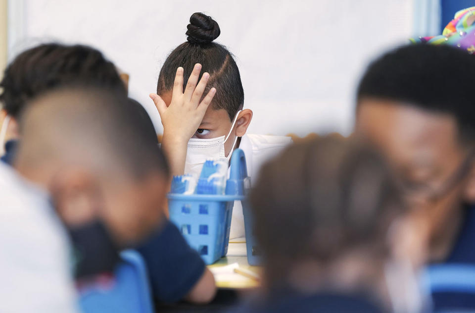 A first grader pauses during an assignment at Burrus Elementary in Houston (Elizabeth Conley / Houston Chronicle via AP file)