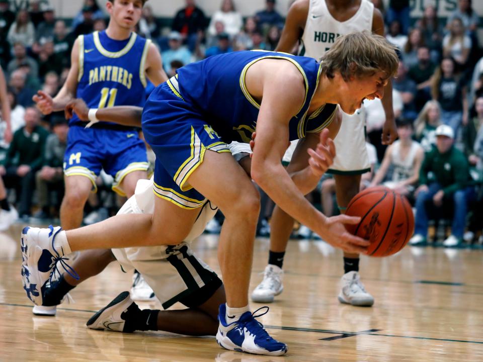 Senior Hayden Jarrett corrals a loose ball during Maysville's win against host Malvern earlier this season. The first-team All-Ohioan will continue his basketball career, signing his letter of intent to play for Marietta College.