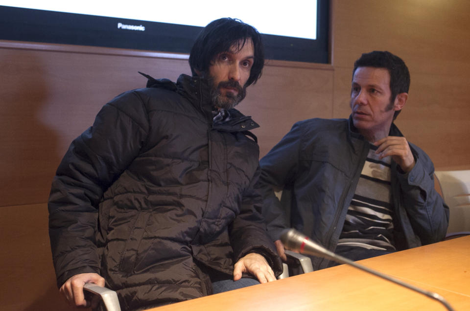 Spanish reporters Javier Espinosa, right, and Ricardo Garcia Vilanova, left, are seen before a press conference upon their arrival in Madrid, Spain, Sunday, March 30, 2014. Two Spanish journalists who were freed after being kidnapped for more than six months in Syria by a rogue al-Qaida group are flying back home Sunday, Spain’s Defense Ministry said. The El Mundo newspaper reported earlier that its war correspondent Javier Espinosa made contact late Saturday from Turkey, where he and photographer Ricardo Garcia Vilanova were under military protection. (AP Photo/Gabriel Pecot)