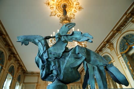 The iconic copper rooster, which was perched at the top of the spire of Notre-Dame Cathedral for more than a century is displayed at the exhibition "Revoir Notre-Dame de Paris\