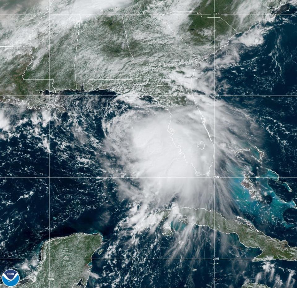 Tropical Storm Sally moves west-northwestward through the Gulf of Mexico in this satellite photo Sunday. The storm was expected to strengthen into a hurricane on Monday.