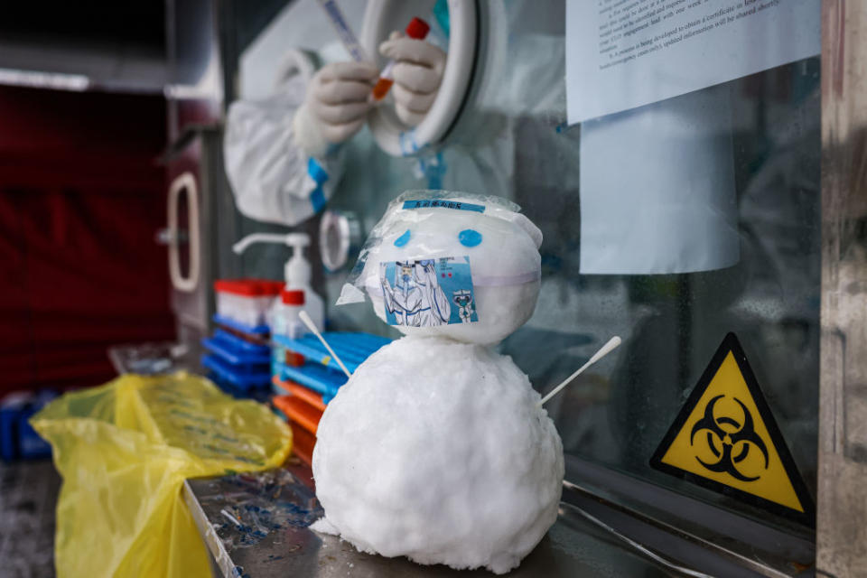 A snowman seen wearing a face mask at an COVID testing booth on February 13, 2022 in Beijing, China.<span class="copyright">Annice Lyn/Getty Images</span>