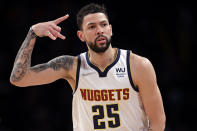 Denver Nuggets guard Austin Rivers reacts after making a 3-point basket against the Brooklyn Nets during the second half of an NBA basketball game Wednesday, Jan. 26, 2022, in New York. The Nuggets won 124-118. (AP Photo/Adam Hunger)