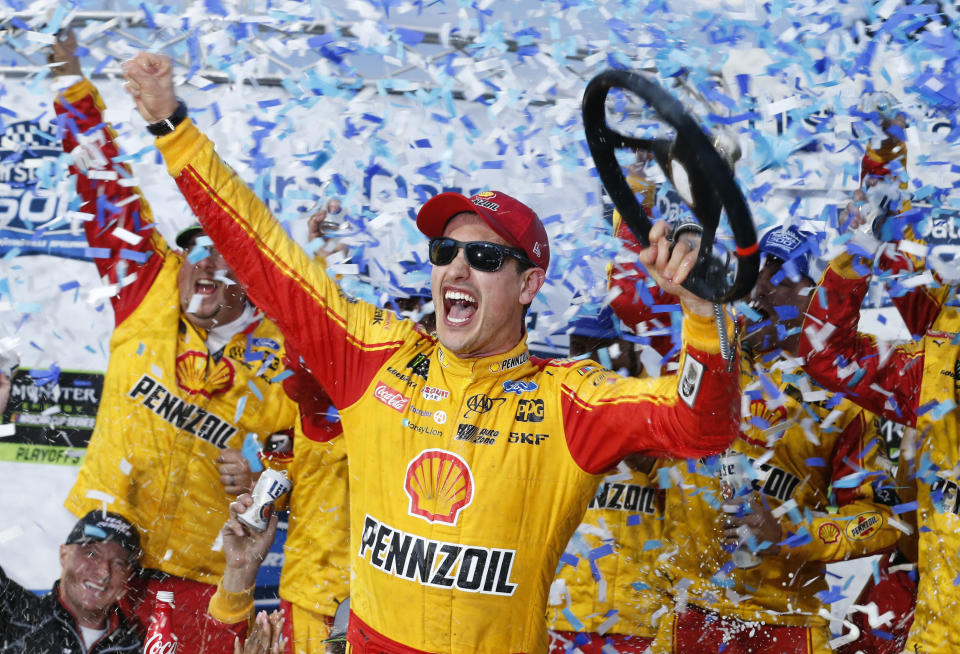 Joey Logano celebrates after winning the Monster Energy NASCAR Cup Series auto race at Martinsville Speedway in Martinsville, Va., Sunday, Oct. 28, 2018. (AP Photo/Steve Helber)