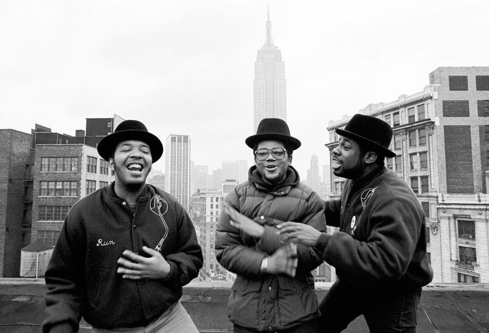 Run-D.M.C. on a rooftop with the Empire State Building in the background. (John R. Nordell / Getty Images)