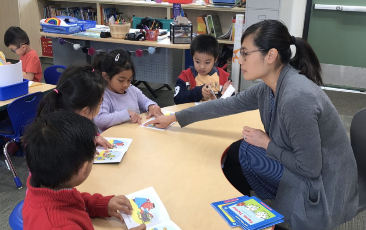 Teacher Nancy Yue works with children in the Vietnamese-English dual immersion program at Windmill Springs Elementary in Franklin-McKinley School District in San Jose.