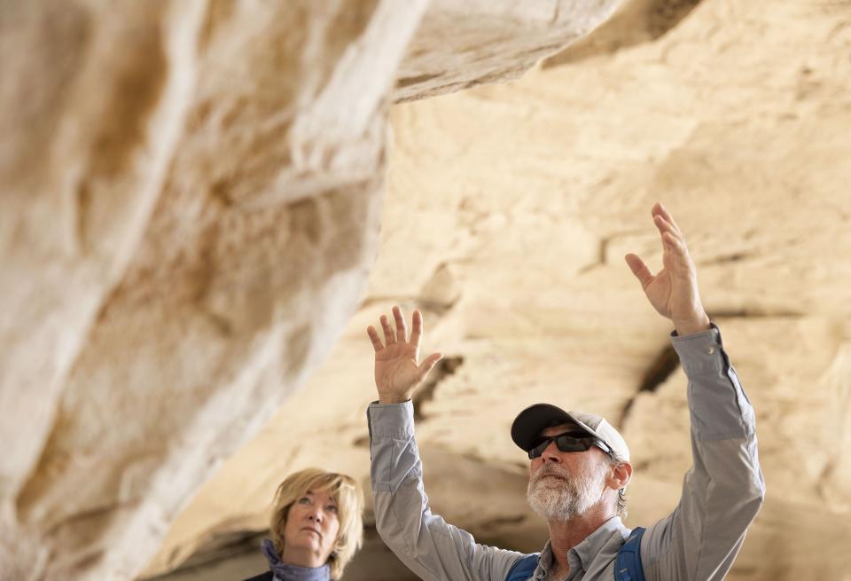Marc Woodard, a guide with Adventure Partners, speaks to Amangiri guests inside Broken Arrow Cave in Canyon Point, Utah, on Wednesday, May 17, 2023. | Laura Seitz, Deseret News