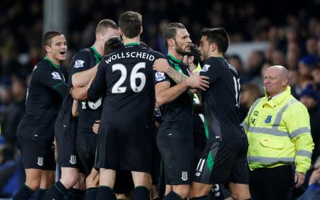 Football Soccer - Everton v Stoke City - Barclays Premier League - Goodison Park - 28/12/15 Stoke's Marko Arnautovic (hidden) celebrates scoring their fourth goal with Erik Pieters and Joselu Action Images via Reuters / Carl Recine Livepic