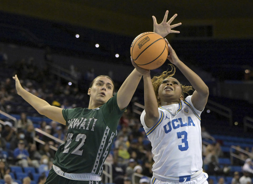 Hawaii forward Imani Perez, left, defends against a shot by UCLA guard Londynn Jones, right, during the first half of an NCAA college basketball game Thursday, Dec. 21, 2023, in Los Angeles. (AP Photo/Jayne Kamin-Oncea)