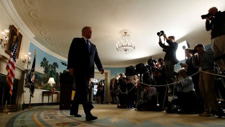 U.S. President Donald Trump walks from the Diplomatic Reception Room after speaking about the Iran nuclear deal at the White House in Washington, U.S., October 13, 2017. REUTERS/Kevin Lamarque/Files