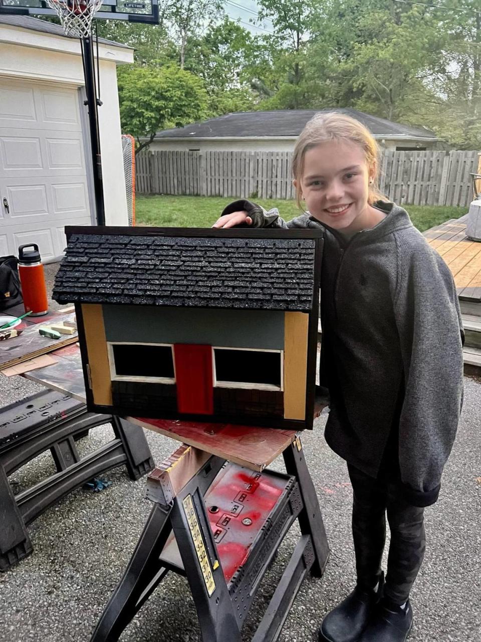 Stella Heathcoat, 11, built a Little Free Library that is a replica of the Chevy Chase Inn on Euclid, which is co-owned by her parents Kevin and Cameron Heathcoat. It was school project that will honor late bartender and family friend Russell Salyer.