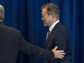 South Korean President Moon Jae-In is escorted by United Nations Secretary-General Antonio Guterres after a photo opportunity Monday, Sept. 24, 2018, at U.N. headquarters. (AP Photo/Craig Ruttle)