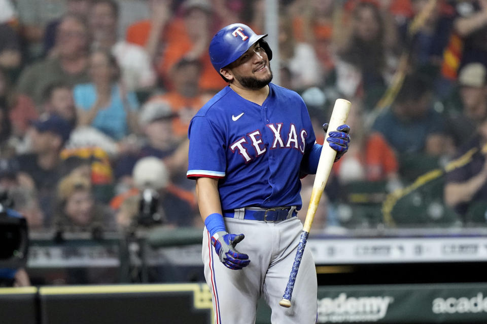 Texas Rangers' Jose Trevino reacts after striking out against the Houston Astros during the seventh inning of a baseball game Thursday, May 13, 2021, in Houston. (AP Photo/David J. Phillip)