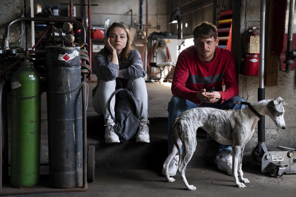 This image released by Paramount Pictures shows Jessica Barden, left, and Jack O'Connell in a scene from "Jungleland." (Dana Starbard/Paramount Pictures via AP)