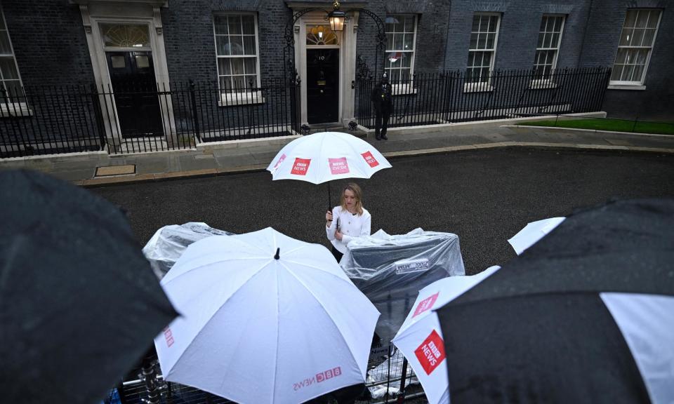 <span>After a dramatic night the media wait outside No 10 for the changing of the political guard, although the City remains relatively unmoved.</span><span>Photograph: Justin Tallis/AFP/Getty Images</span>