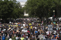 People start marching at Lincoln Memorial toward the Martin Luther King Jr. Memorial during the March on Washington, Friday Aug. 28, 2020, on the 57th anniversary of the Rev. Martin Luther King Jr.'s "I Have A Dream" speech. (AP Photo/Jose Luis Magana)