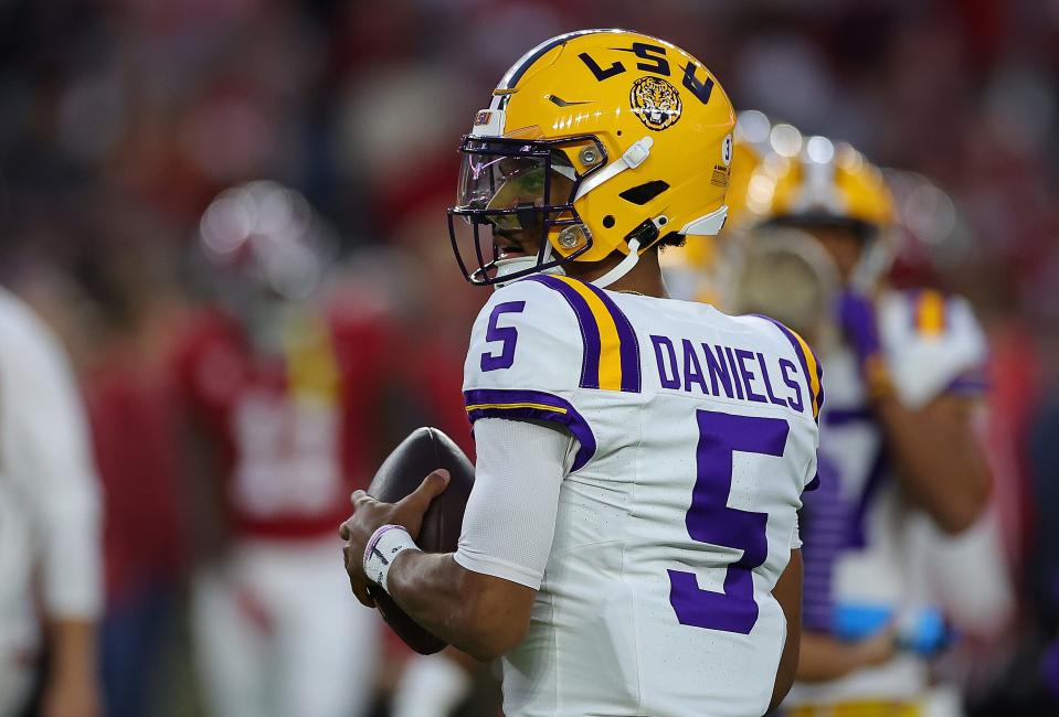 TUSCALOOSA, ALABAMA - NOVEMBER 04: Jayden Daniels #5 of the LSU Tigers warms up prior to facing the Alabama Crimson Tide at Bryant-Denny Stadium on November 04, 2023 in Tuscaloosa, Alabama. (Photo by Kevin C. Cox/Getty Images)