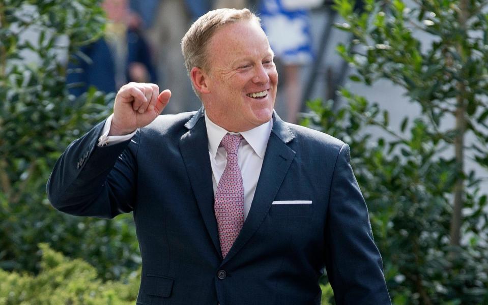 Sean Spicer gestures outside the West Wing of the White House in Washington on Friday - Credit: MICHAEL REYNOLDS/EPA