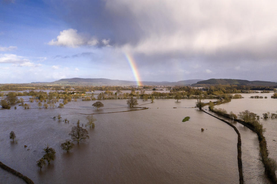 HEREFORD, ENGLAND - FEBRUARY 17: A rainbow appears over flooded fields in the Wye Valley, near the hamlet of Wellesley, following Storm Dennis on February 17, 2020 in Hereford, England. Storm Dennis is the second named storm to bring extreme weather in a week and follows in the aftermath of Storm Ciara. (Photo by Christopher Furlong/Getty Images)