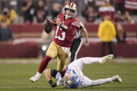 San Francisco 49ers quarterback Brock Purdy (13) runs against Detroit Lions linebacker Alex Anzalone during the second half of the NFC Championship NFL football game in Santa Clara, Calif., Sunday, Jan. 28, 2024. (AP Photo/Mark J. Terrill)