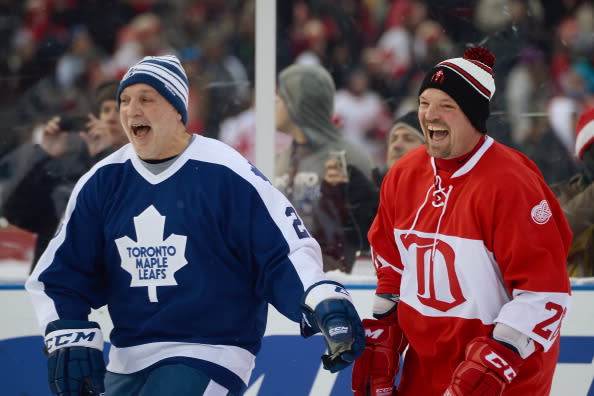 DETROIT, MI - DECEMBER 31: Tiger Williams #22 of the Toronto Maple Leafs and Joe Kocur #26 of the Detroit Red Wings share a laugh on the ice before the start of the game during the 2013 Hockeytown Winter Festival Alumni Showdown on December 31, 2013 at Comerica Park in Detroit, Michigan. (Photo by Jamie Sabau/Getty Images)
