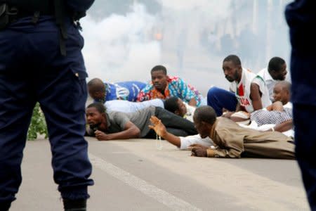 Riot policemen fire teargas canisters to disperse demonstrators during a protest organised by Catholic activists in Kinshasa, Democratic Republic of Congo January 21, 2018. REUTERS/Kenny Katombe