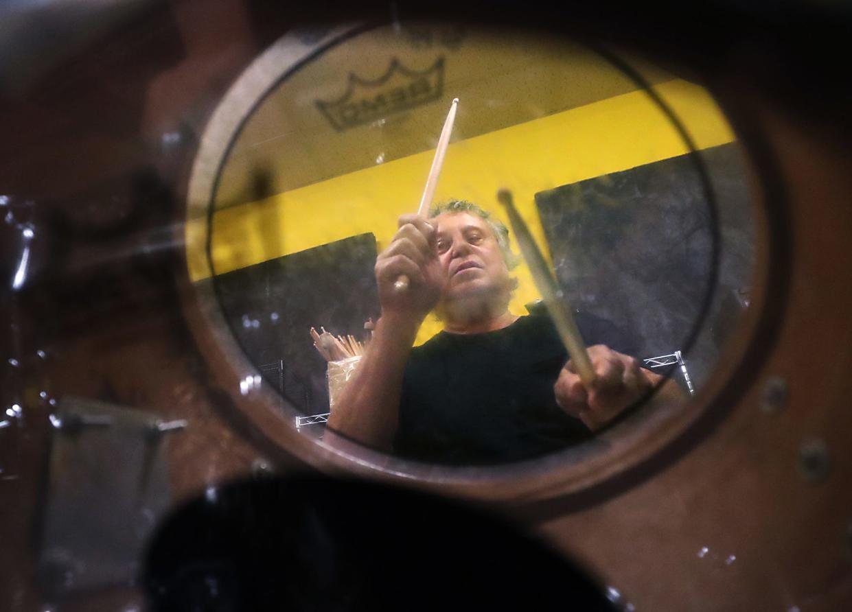 Pictured through a drum, Chris Butler has re-created the Slingerland kit that he owned as a kid in the 1960s. He will play it for the first time with Dave Rich and His Enablers during PorchRokr on Saturday, Aug. 19, at Highland Square in Akron.