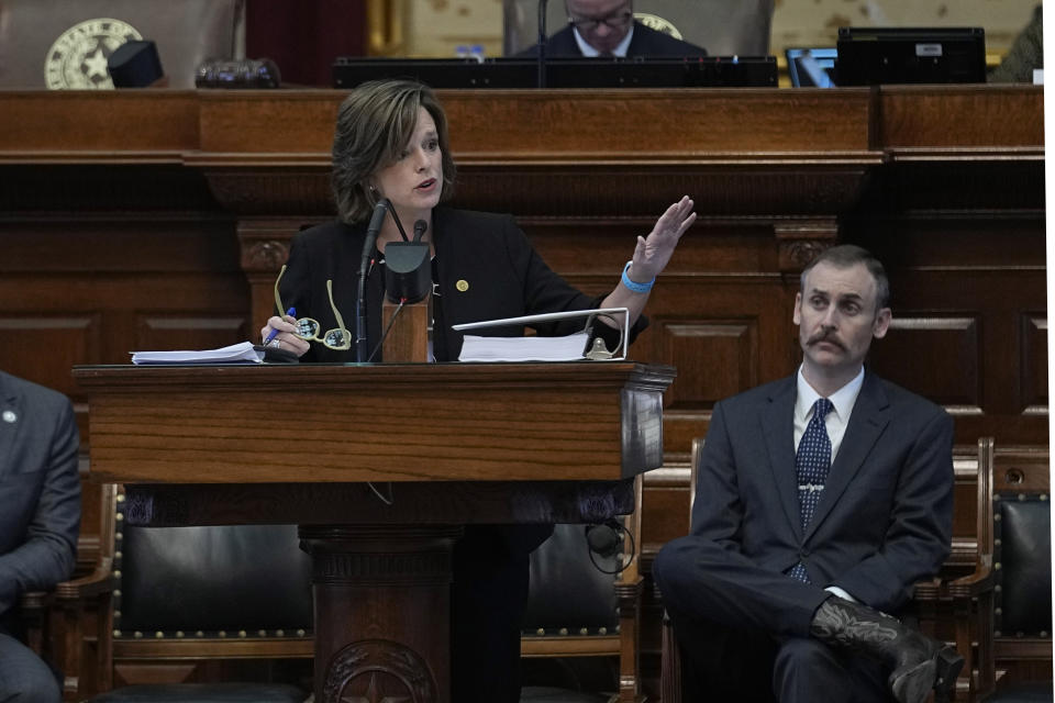 Rep. Andrew Murr, R - Junction, Chair of the House General Investigating Committee, right, listens as Rep. Ann Johnson, D - Houston, Vice Chair, speaks during the impeachment proceedings against state Attorney General Ken Paxton in the House Chamber at the Texas Capitol in Austin, Texas, Saturday, May 27, 2023. Texas lawmakers have issued 20 articles of impeachment against Paxton, ranging from bribery to abuse of public trust as state Republicans surged toward a swift and sudden vote that could remove him from office. (AP Photo/Eric Gay)