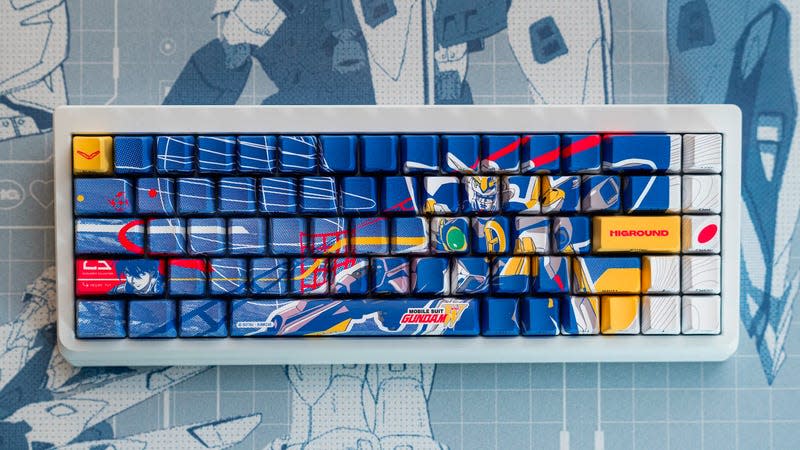 The Higround Summit 65 Gundam Wing keyboard photographed against Gundam Wing schematics.