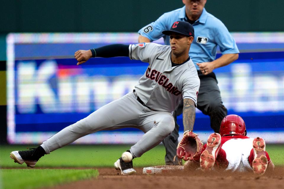 Reds second baseman Matt McLain steals second as Cleveland Guardians shortstop Brayan Rocchio catches the throw from the plate in the third inning at Great American Ball Park on Wednesday, Aug. 16, 2023.