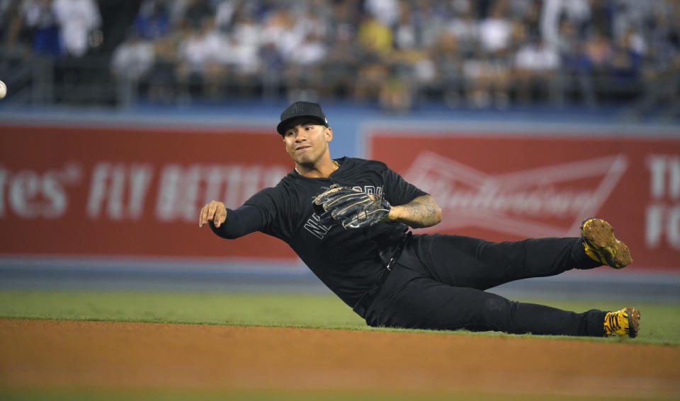 New York Yankees second baseman Gleyber Torres throws out Los Angeles Dodgers' Matt Beaty at first during the seventh inning of a baseball game Friday, Aug. 23, 2019, in Los Angeles. (AP Photo/Mark J. Terrill)