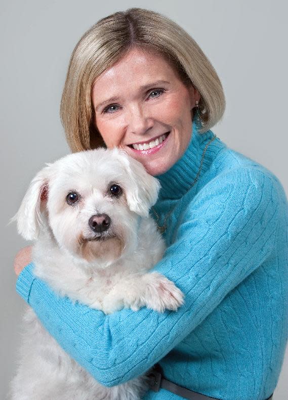 This 2010 photo released by Richmond SPCA Robins-Starr Humane Center shows Robin Robertson Starr and her dog Niblett. Robertson Starr, the chief executive officer of the Richmond Society for the Prevention of Cruelty to Animals said of Niblett "He is one of the most beloved pets of my whole life, my dog that I adore with all of my heart. I adopted him after he was returned to us," The terrier mix was returned because he barked when the people who initially adopted him left him alone in the backyard. (AP Photo/Trina Flanery)