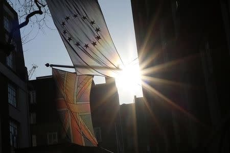 A European Union flag and the United Kingdom's Union flag fly outside Europe House, the office of the European Commission in London, Britain January 20, 2016. REUTERS/Stefan Wermuth