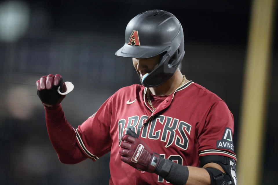 Arizona Diamondbacks' Lourdes Gurriel Jr. celebrates his RBI single off Colorado Rockies relief pitcher Justin Lawrence during the ninth inning of a baseball game Tuesday, Aug. 15, 2023, in Denver. (AP Photo/David Zalubowski)