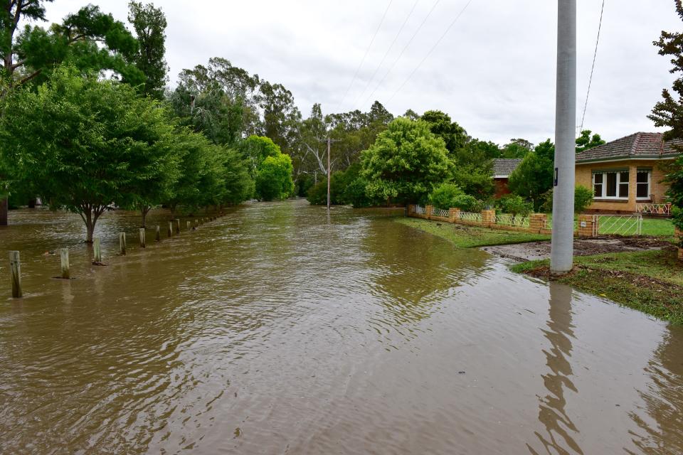 Flash floods could spell new complications for firefighters in Victoria. Pictured is a stock image of floods in the Alpine region.