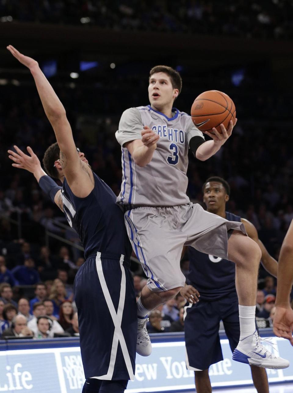 Creighton's Doug McDermott (3) drives past Xavier's Isaiah Philmore during the first half of an NCAA college basketball game in the semifinals of the Big East Conference tournament Friday, March 14, 2014, at Madison Square Garden in New York. (AP Photo/Frank Franklin II)