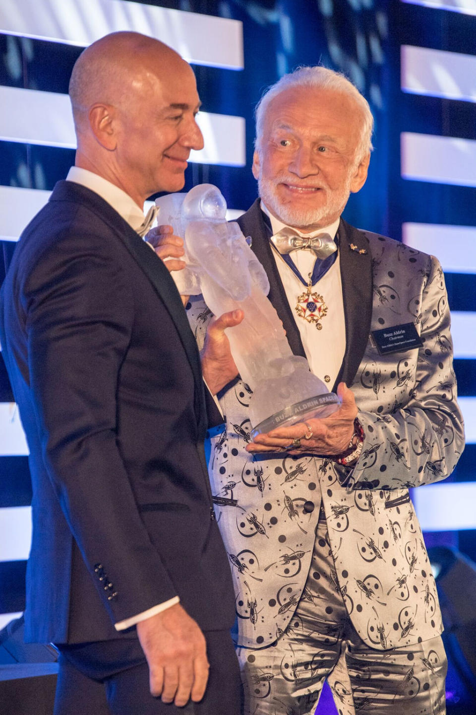 Jeff Bezos receives the first annual Buzz Aldrin Space Innovation Award from Apollo 11 moonwalker Buzz Aldrin at an Apollo 11 anniversary gala on July 15, 2017. <cite>Chuck Davis</cite>