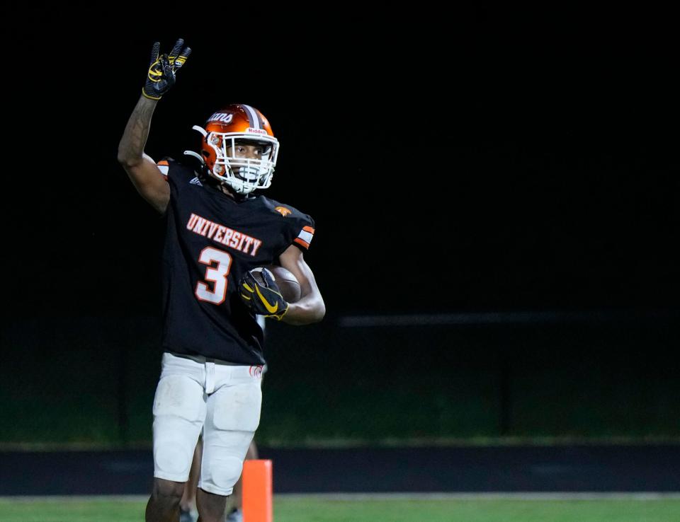 University's Jermane Hayes celebrates scoring after making a reception and running in for a touchdown during a game with Spruce Creek at University High School in Orange City, Friday, Oct. 13, 2023.