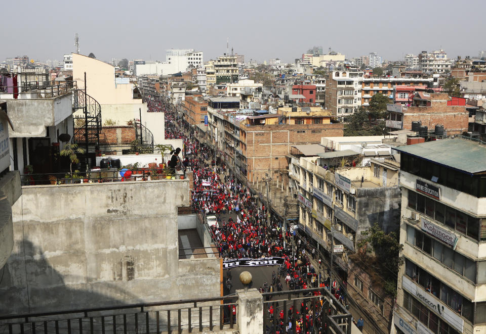 Nepalese supporters of the splinter group in the governing Nepal Communist Party participate in a protest in Kathmandu, Nepal, Friday, Jan. 22, 2021. Thousands of demonstrators rallied in Nepal’s capital Friday protesting against the prime minister who had dissolved the parliament and ordered fresh election because of feuds within the ruling political party. (AP Photo/Niranjan Shrestha)