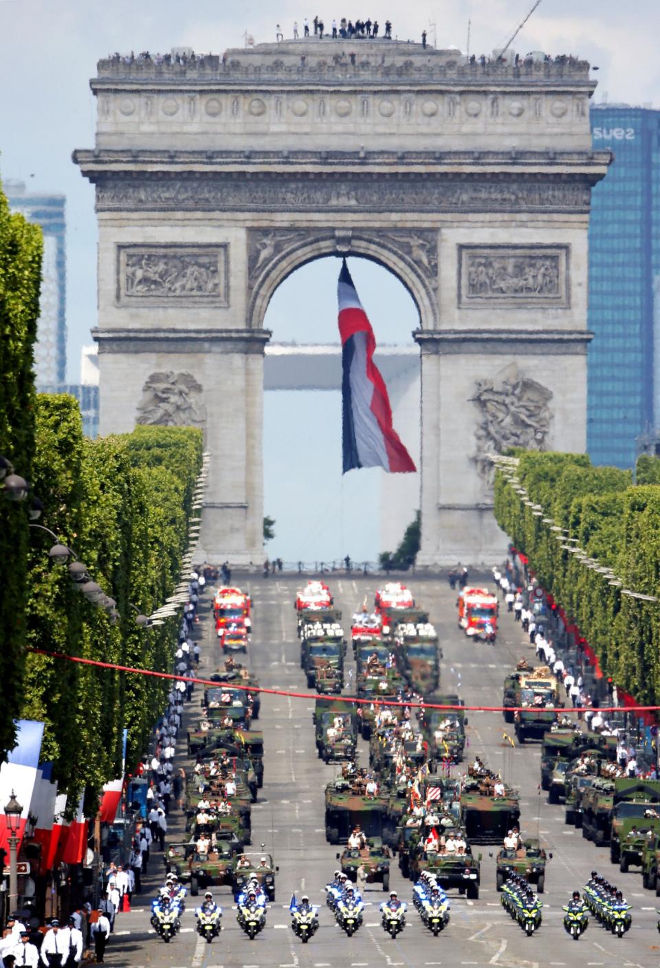 <p>Tanks roll down the Champs-Elysee avenue with the Arc de Triomphe in the background during the traditional Bastille Day military parade in Paris, France, July 14, 2017. (Photo: Gonzalo Fuentes/Reuters) </p>