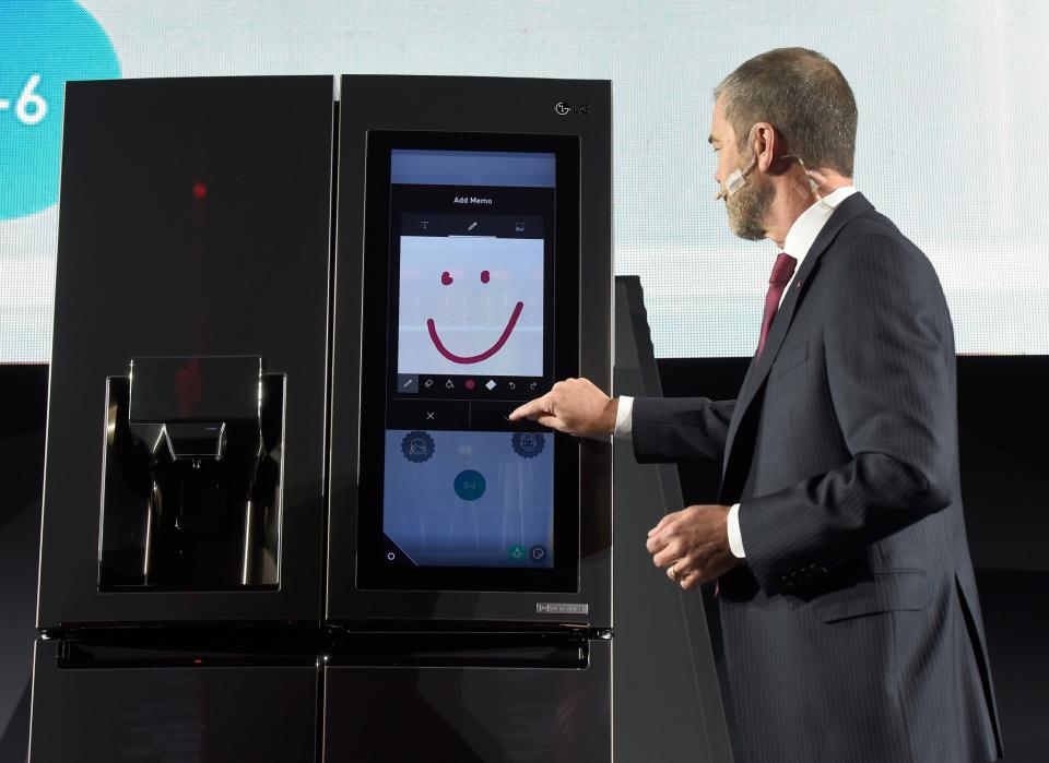 <p>LG Electronics USA Vice President of Marketing David VanderWaal demostrates the LG Smart InstaView Door-in-Door refrigerator during a LG press event for CES 2017 at the Mandalay Bay Convention Center on January 4, 2017 in Las Vegas, Nevada. The touchscreen allows you to track groceries (including expiration dates), integrates with Amazon Echo (so you can order groceries), and will even turn transparent so you can see inside without opening the door. (Getty) </p>