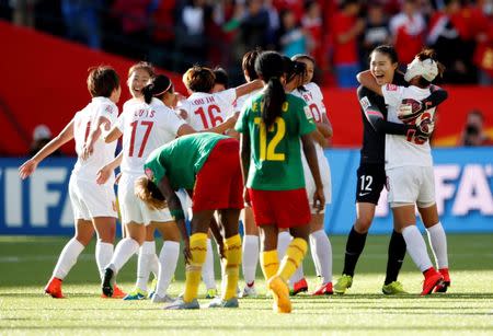 Jun 20, 2015; Edmonton, Alberta, CAN; China goalkeeper Wang Fei (12) celebrates after defeating Cameroon in the round of sixteen in the FIFA 2015 women's World Cup soccer tournament at Commonwealth Stadium. China won 1-0. Mandatory Credit: Erich Schlegel-USA TODAY Sports