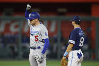 Los Angeles Dodgers' Freddie Freeman (5) reacts at second base after hitting an RBI-double as Kansas City Royals second baseman Michael Massey (19) looks on during the seventh inning of a baseball game in Kansas City, Mo., Friday, Aug. 12, 2022. (AP Photo/Colin E. Braley)