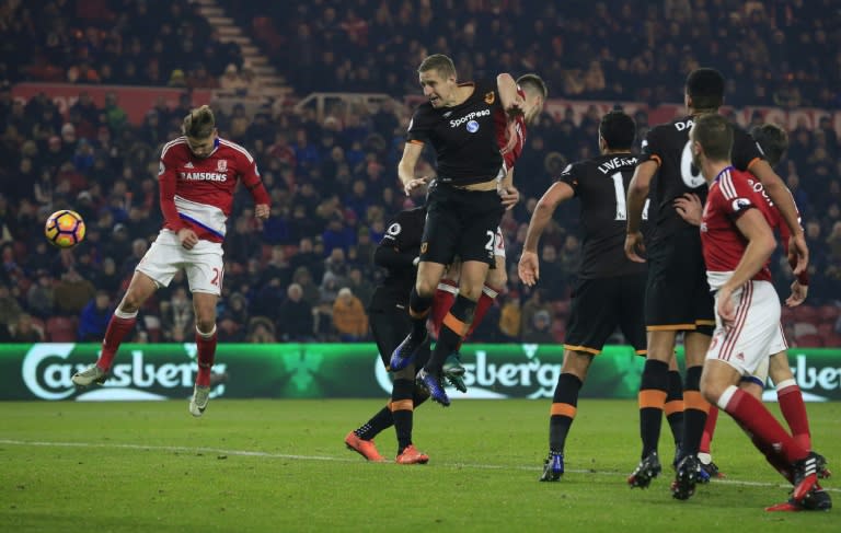 Middlesbrough's Uruguayan midfielder Gaston Ramírez (L) heads the ball to scores his team's first goal during the English Premier League football match between Middlesbrough and Hull City at Riverside Stadium on December 5, 2016